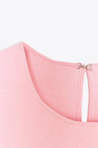 TOP EN MAILLE PÉPLUM AVEC LACETS