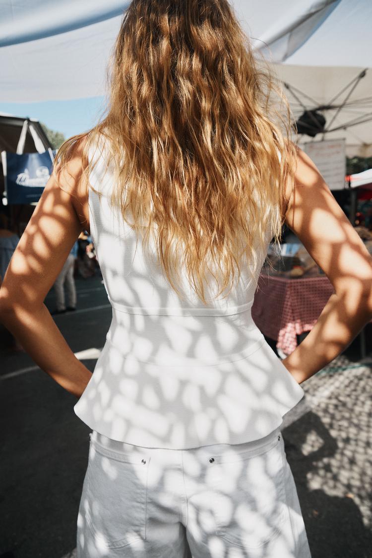 TOP EN MAILLE PÉPLUM AVEC LACETS