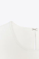 TOP EN MAILLE PÉPLUM AVEC LACETS
