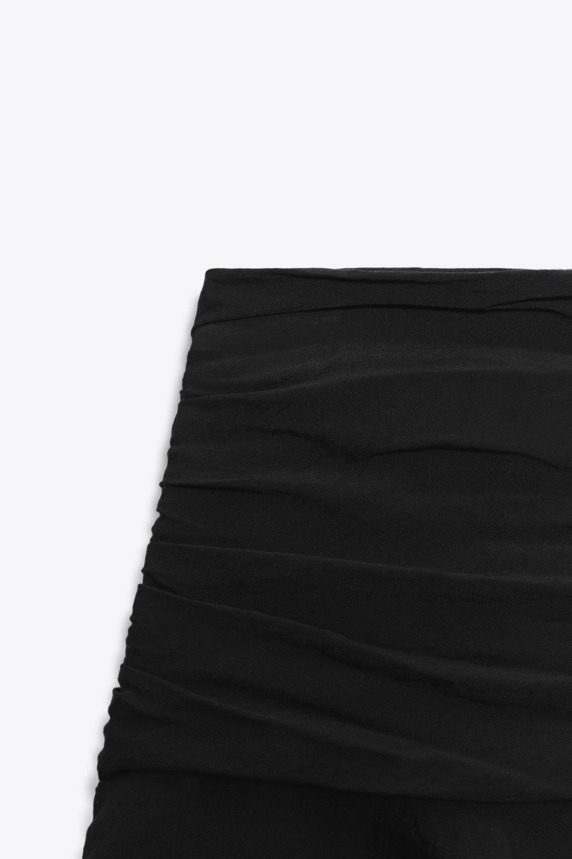 JUPE-CULOTTE À VOLANTS
